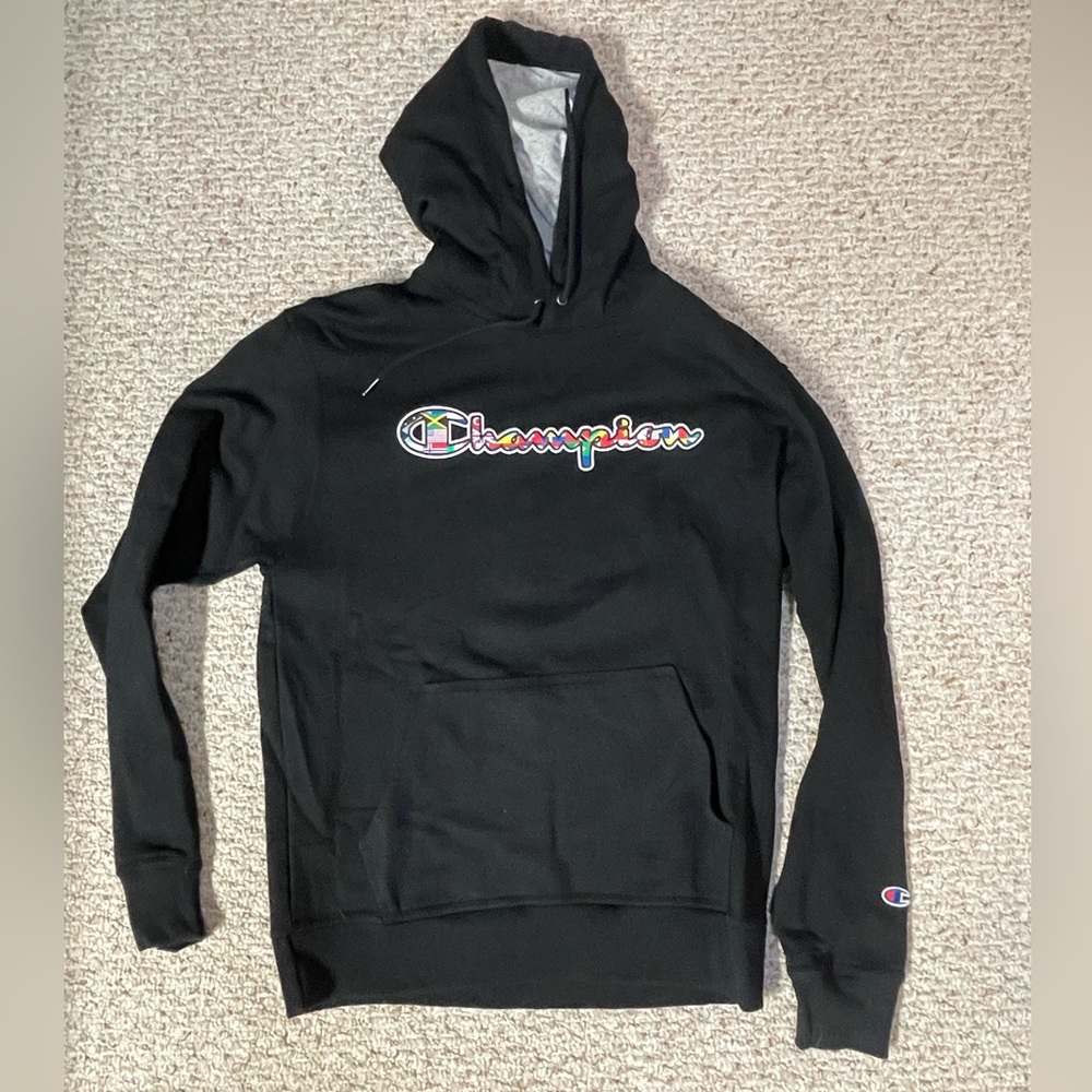 Champion hoodie with mix match flag logo. Size M